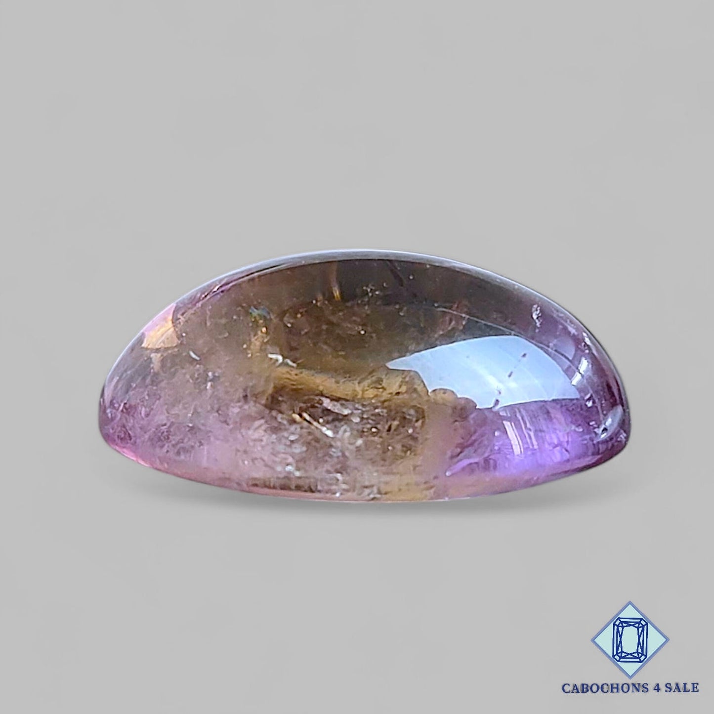 Cabujones ovalados de piedra preciosa ametrina natural de 25 x 19 x 11 mm de Bolivia, disponibles para la venta.