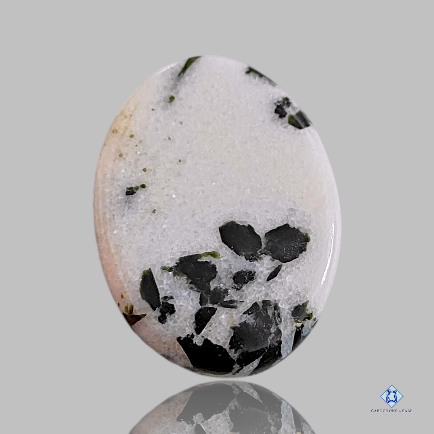 Cabujones ovalados de ágata de punto negro