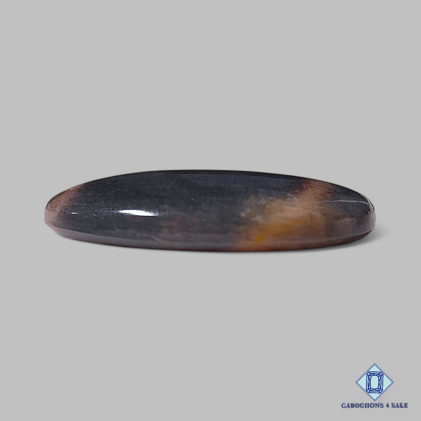 Cabujones ovalados de piedra solar negra natural de Tanzania, 32 x 23 x 5 mm, disponibles para la venta.