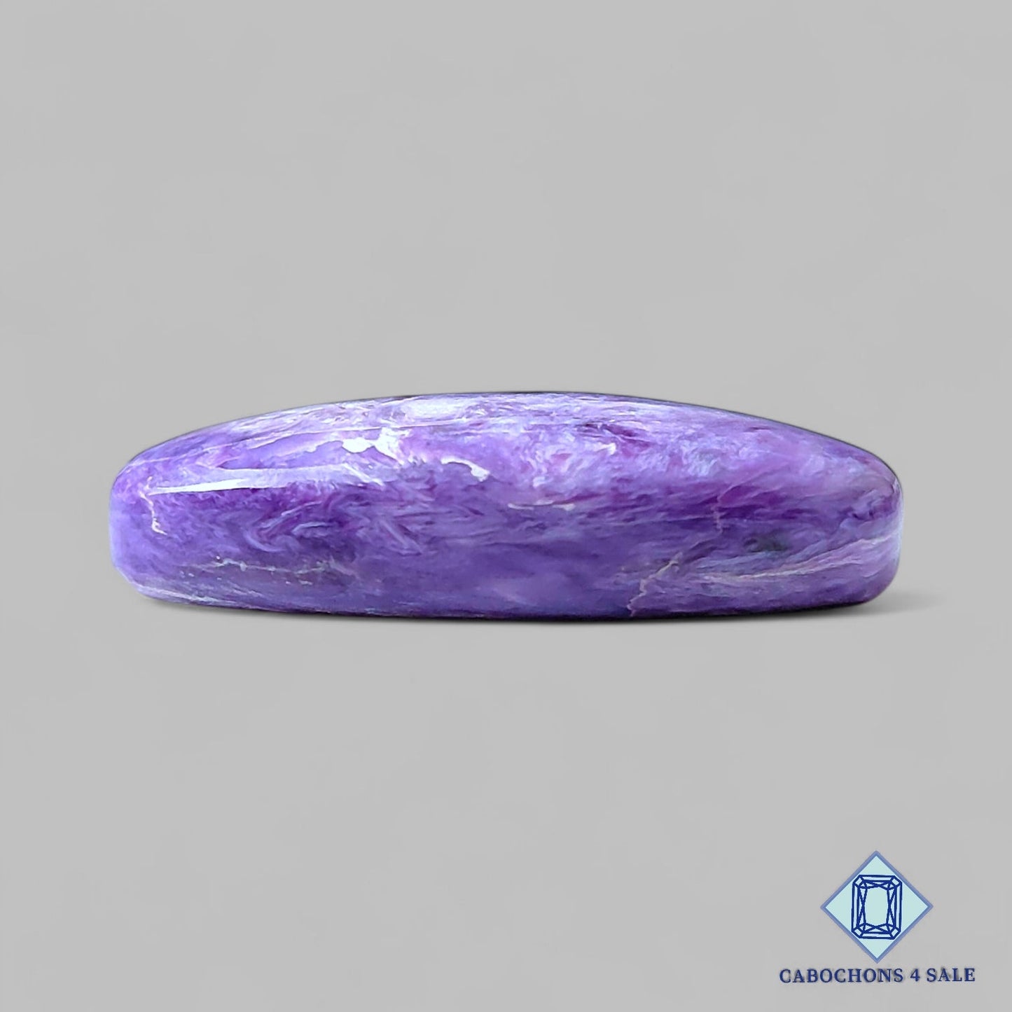 Cabujones ovalados de piedra preciosa de charoita natural de 31 x 16 x 7 mm, procedentes de Rusia, disponibles para la venta.