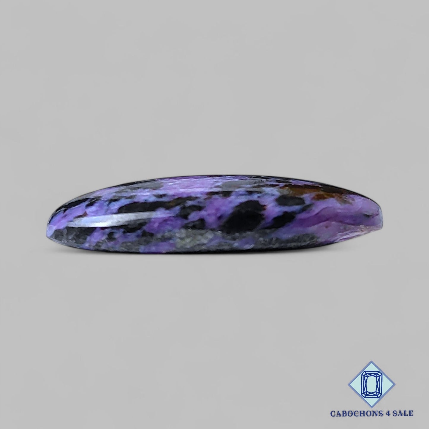 Cabujones ovalados de piedra preciosa de charoita natural de 28 x 15 x 5 mm, procedentes de Rusia, disponibles para la venta.