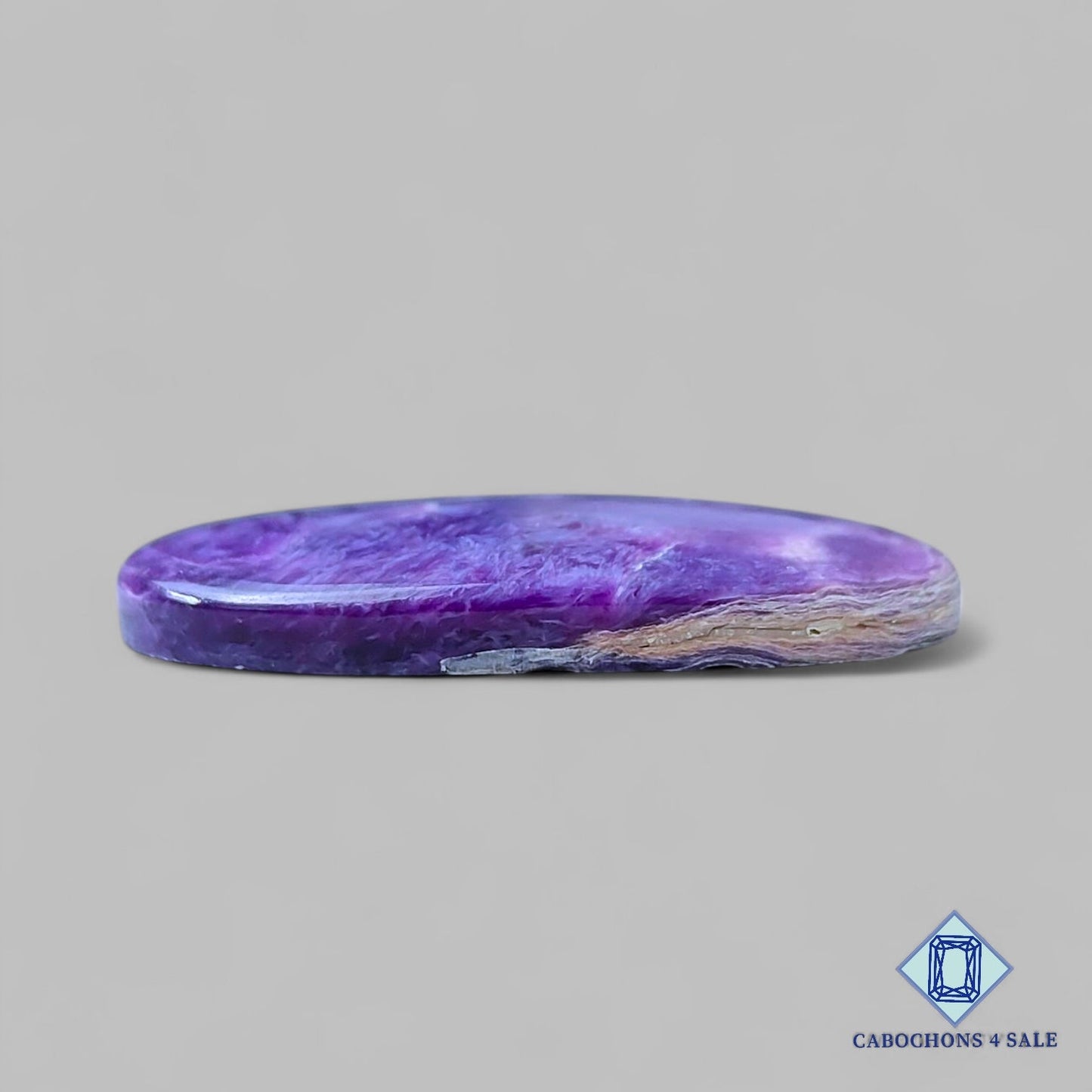 Cabujones ovalados de piedra preciosa de charoita natural de 35 x 21 x 5 mm, procedentes de Rusia, disponibles para la venta.