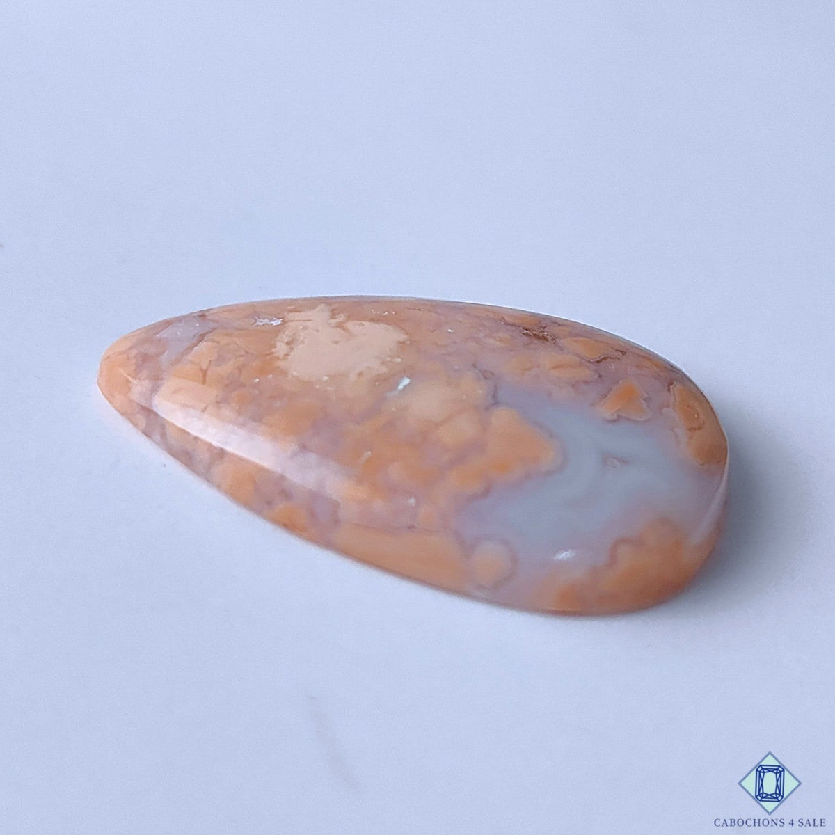 Cabochons4sale orange pear-shaped cotton candy agate cabochon with opaque finish and natural stone patterns