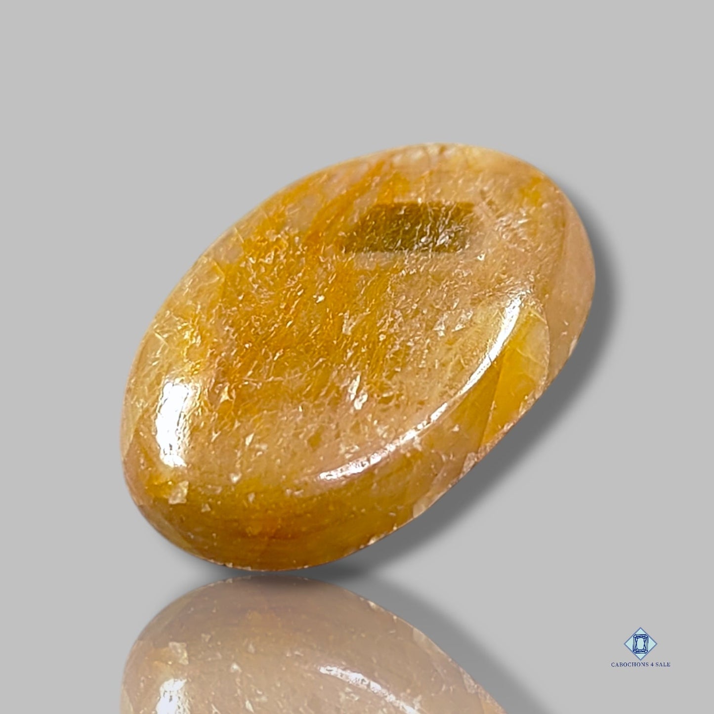 Cabujones ovalados de zafiro dorado