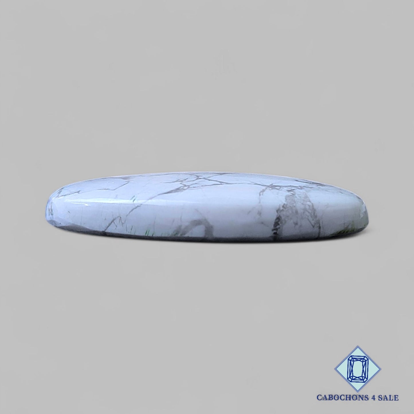 Cabujones ovalados de howlita natural de 38 x 24 x 6 mm, procedentes de California, disponibles para la venta.