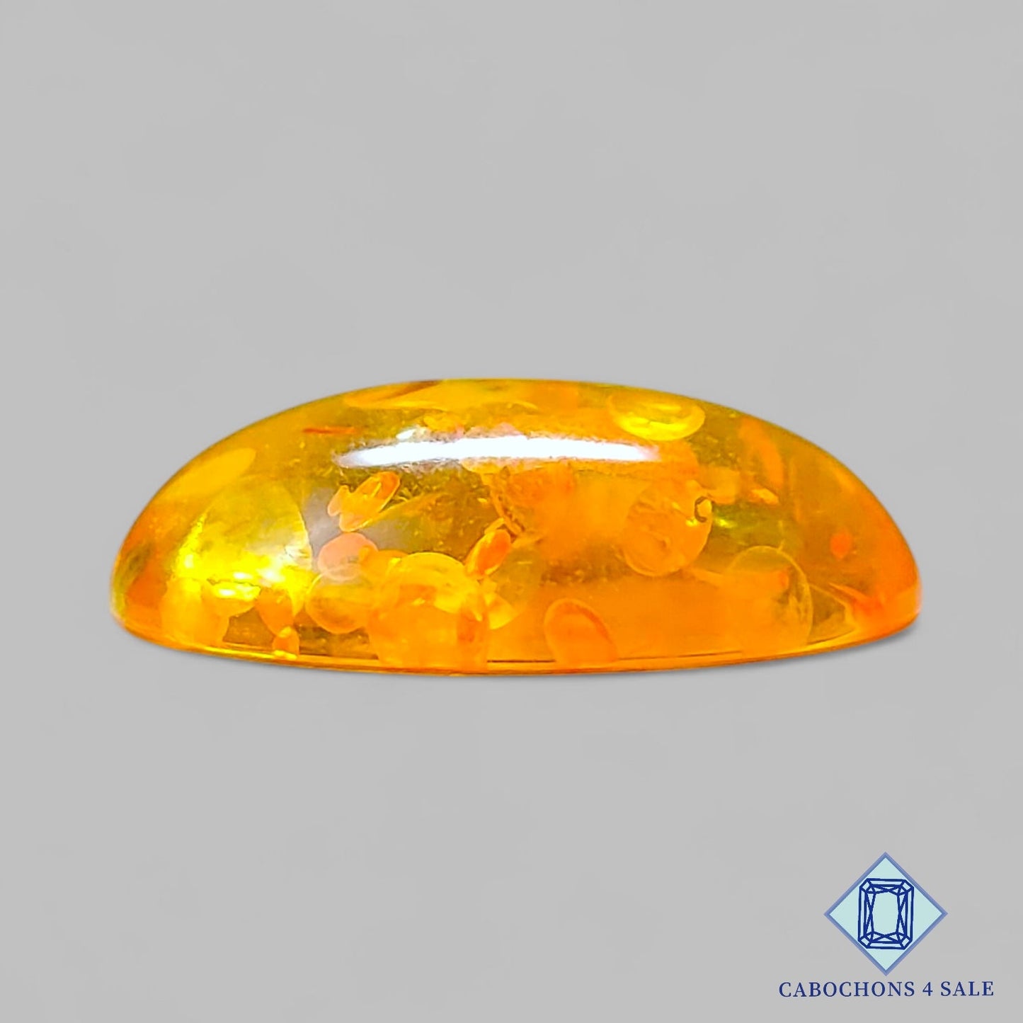Cabujones ovalados de ámbar sintético de 23 x 16 x 6 mm disponibles para la venta.