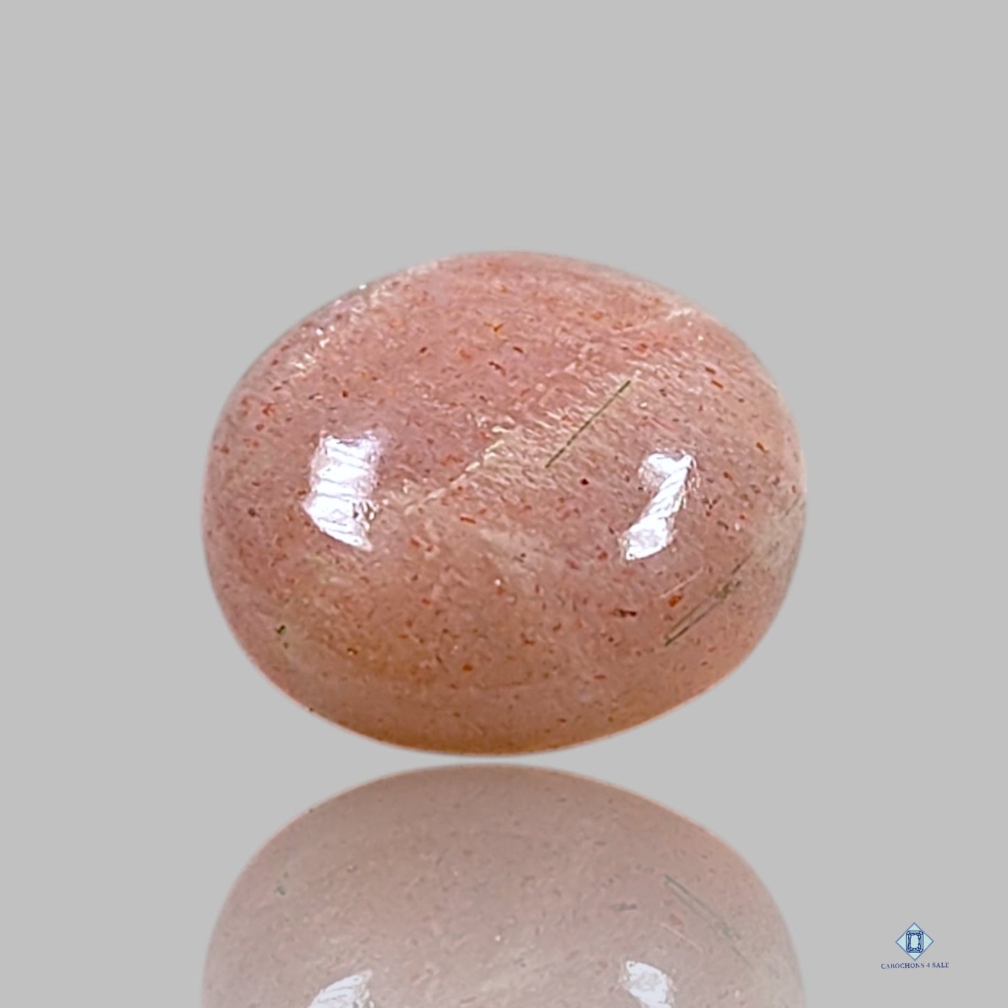 Cabujones redondos de piedra solar con enrejado arcoíris de lluvia de meteoritos