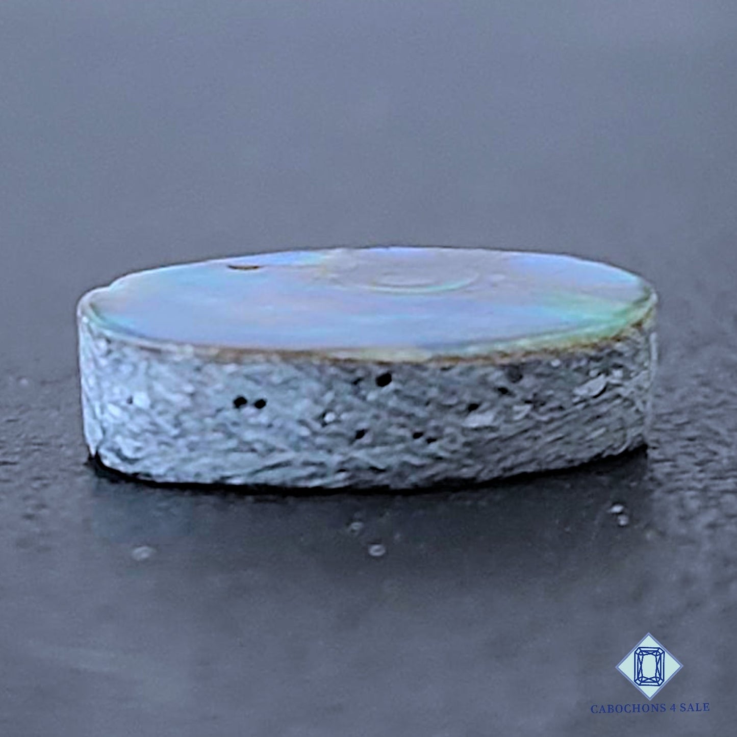 Cabujones ovalados de piedra preciosa de nácar natural de 14 x 10 x 4 mm de Filipinas, disponibles para la venta.