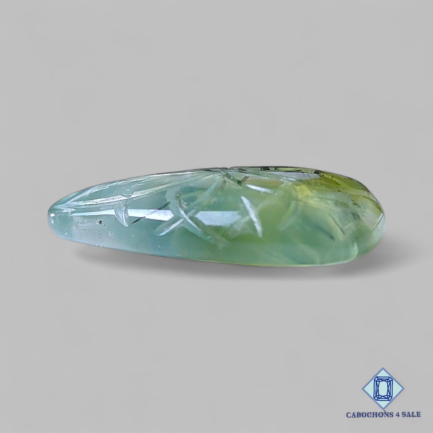 Piedras preciosas de rutilo prehnita natural talladas en forma de pera de 31 x 22 x 6 mm procedentes de Sudáfrica, disponibles para la venta.