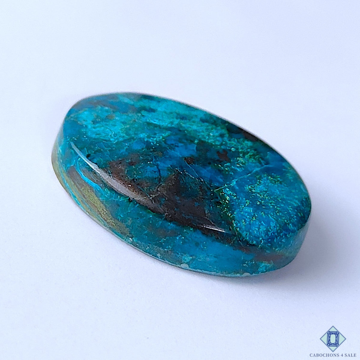 Cabochons4sale oval Quantum Quattro cabochon gemstone with vibrant blue and dark mineral inclusions