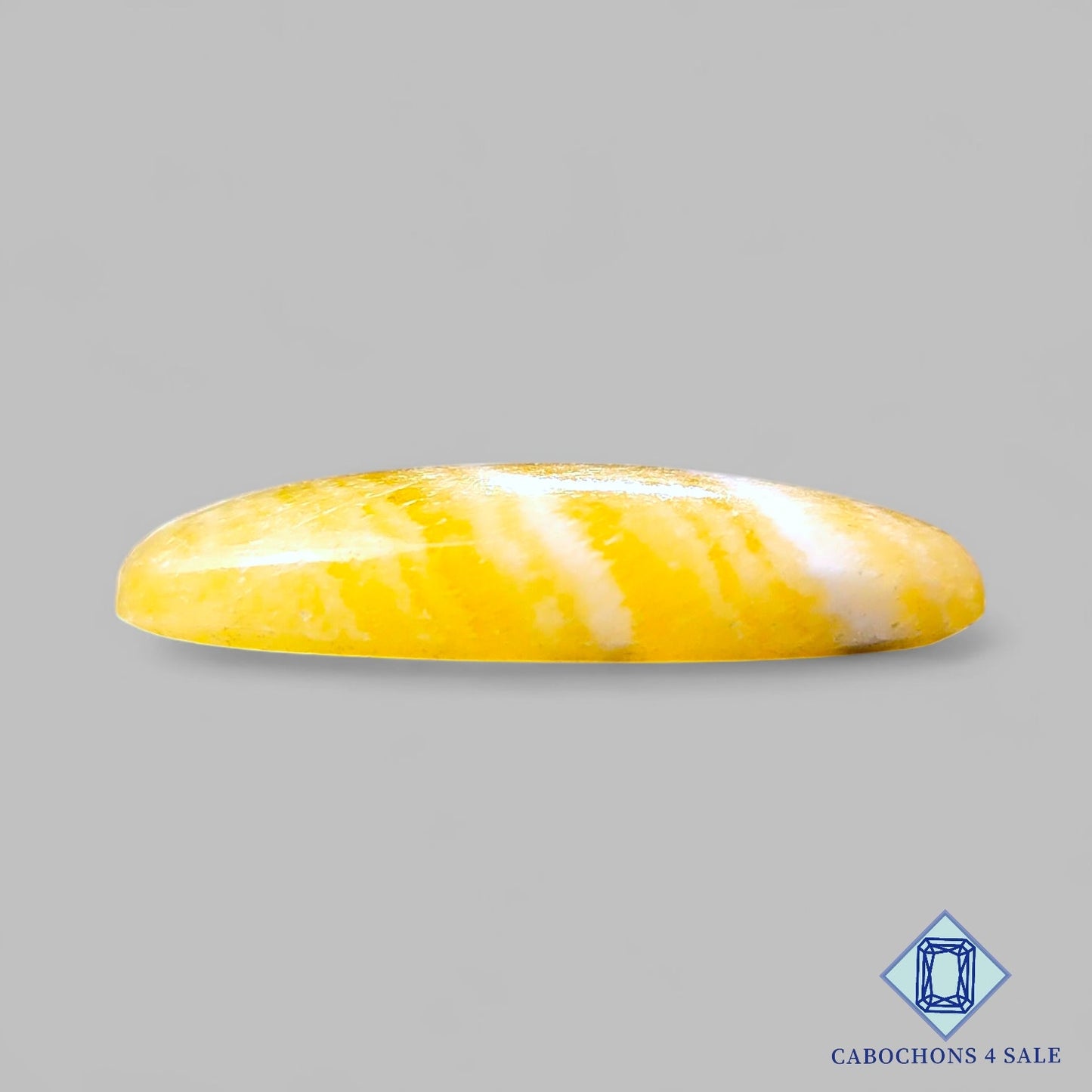 Cabujones ovalados de calcita amarilla natural de 42 x 22 x 8 mm, de México, disponibles para la venta.