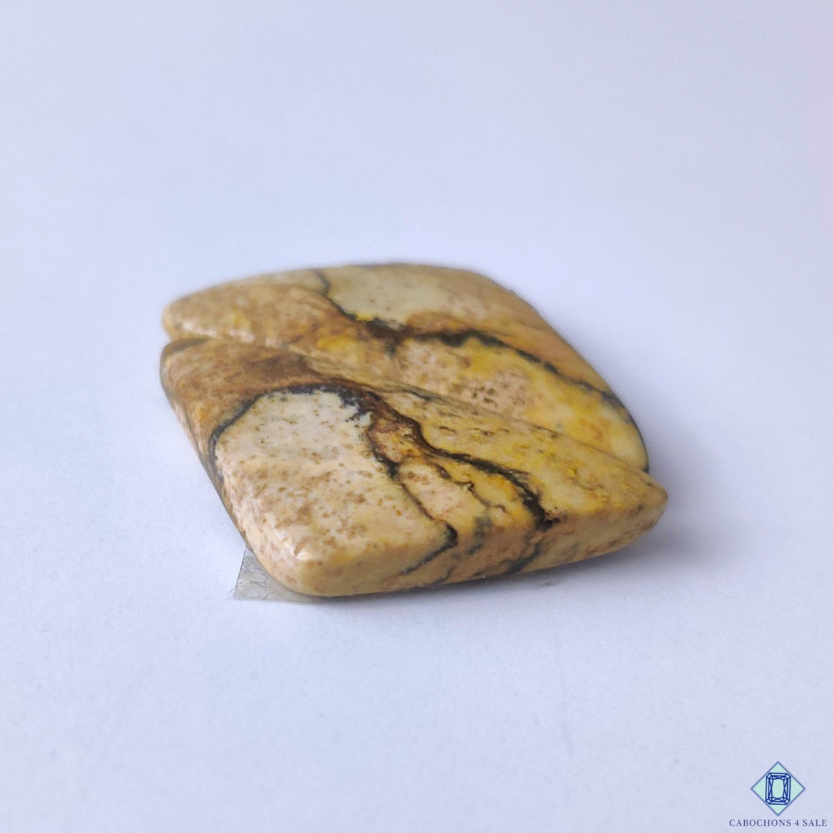 cabochons4sale, distinctive fancy picture jasper cabochons in rich brown shades with striking natural landscape patterns and smooth gemstone finish held between fingers