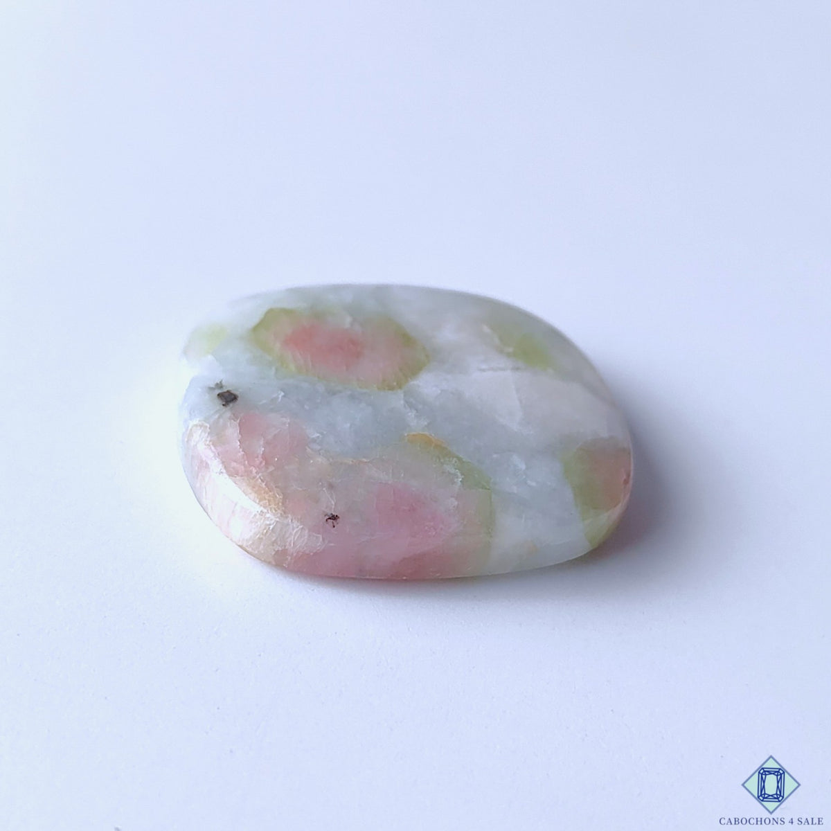 cabochons4sale, polished rectangle watermelon tourmaline quartz cabochons featuring contrasting pink and green tones, distinctive natural zoning and unique gemstone character held between fingers
