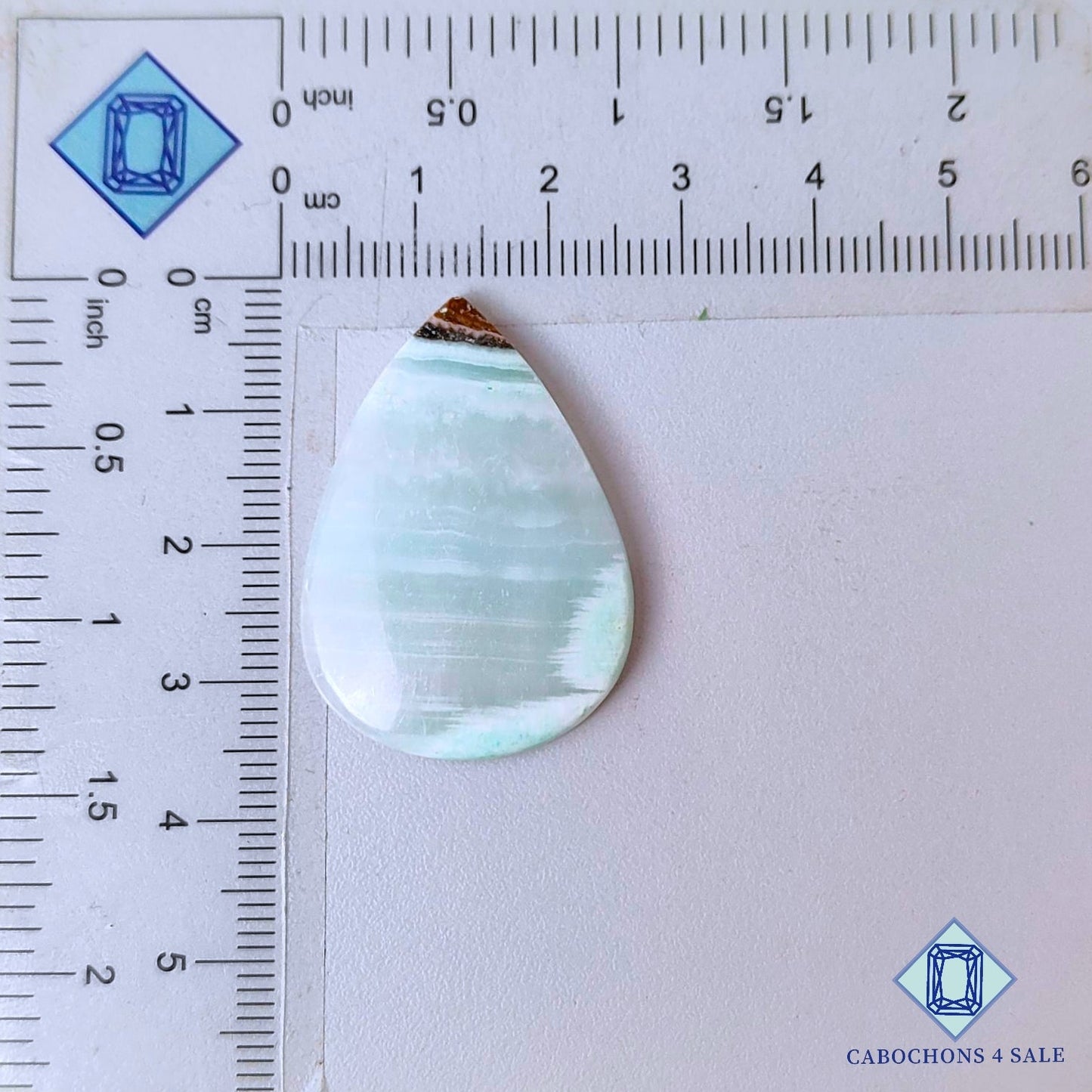 Cabujones de piedra preciosa de argonita natural en forma de pera de 34 x 24 x 4 mm, procedentes de Marruecos, disponibles para la venta.