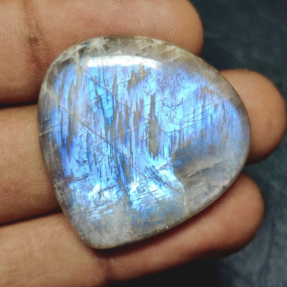 Cabochons4sale pear-shaped Belomorite cabochon with a translucent white body and vibrant blue adularescence