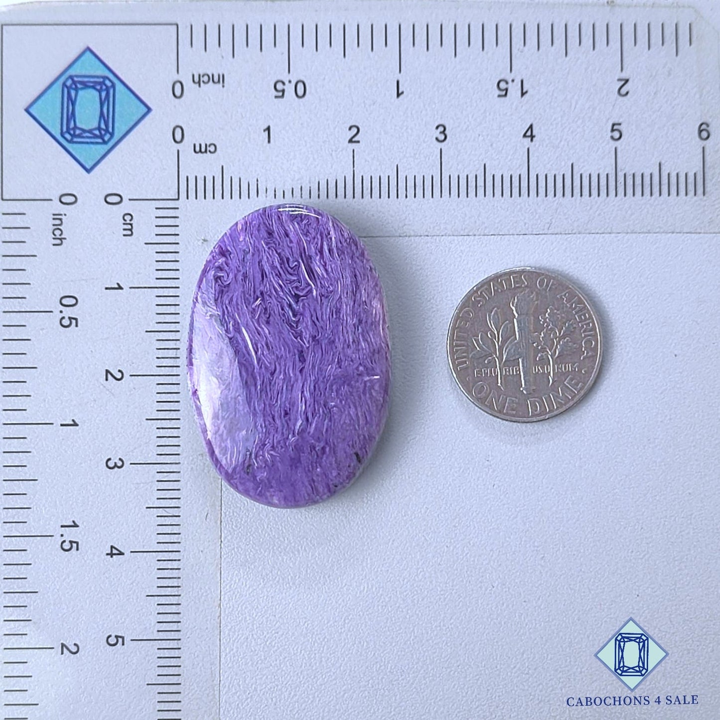 Cabujones ovalados de piedra preciosa de charoita natural de 34 x 23 x 7 mm, procedentes de Rusia, disponibles para la venta.