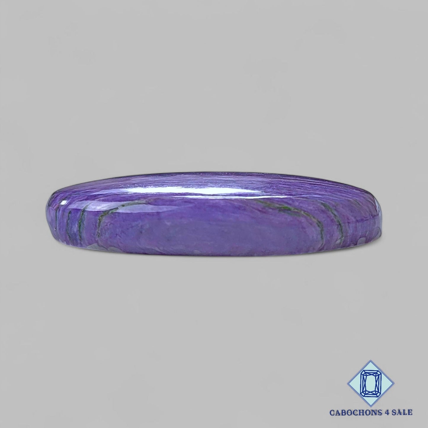 Cabujones ovalados de piedra preciosa de charoita natural de 36 x 23 x 7 mm, procedentes de Rusia, disponibles para la venta.