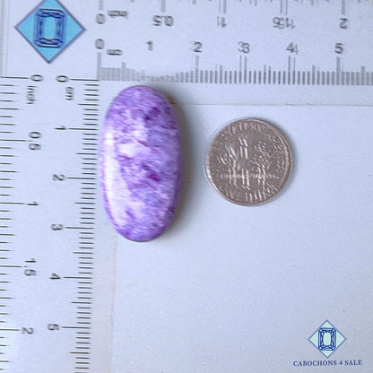 Cabujones ovalados de piedra preciosa de charoita natural de 31 x 16 x 7 mm, procedentes de Rusia, disponibles para la venta.