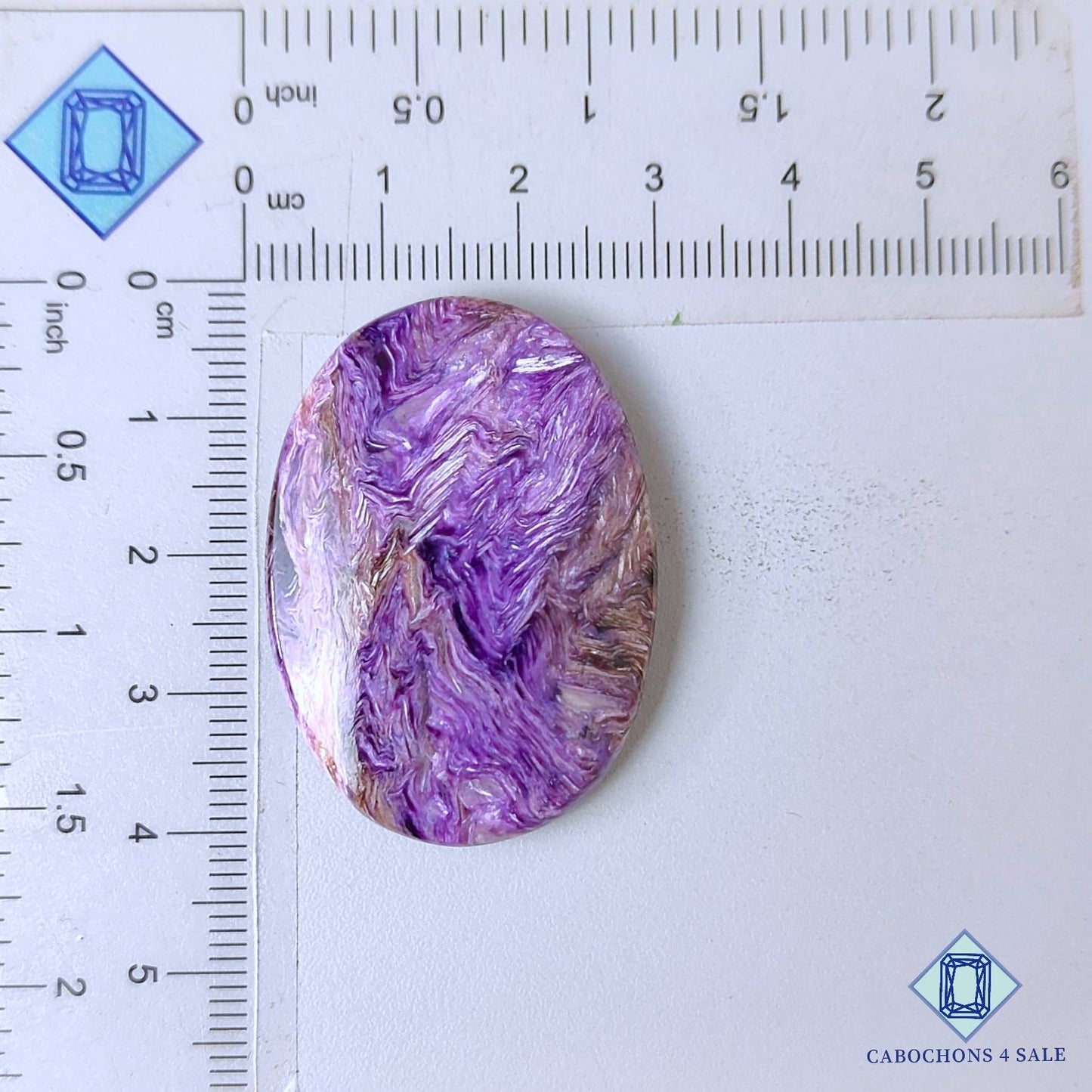 Cabujones ovalados de piedra preciosa de charoita natural de 39 x 28 x 6 mm, procedentes de Rusia, disponibles para la venta.