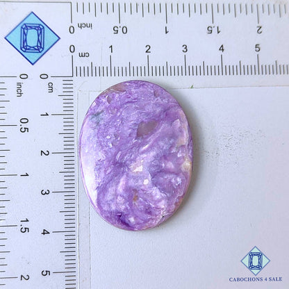 Cabujones ovalados de piedra preciosa de charoita natural de 39 x 29 x 6 mm, procedentes de Rusia, disponibles para la venta.