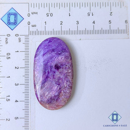 Cabujones ovalados de piedra preciosa de charoita natural de 43 x 24 x 6 mm, procedentes de Rusia, disponibles para la venta.