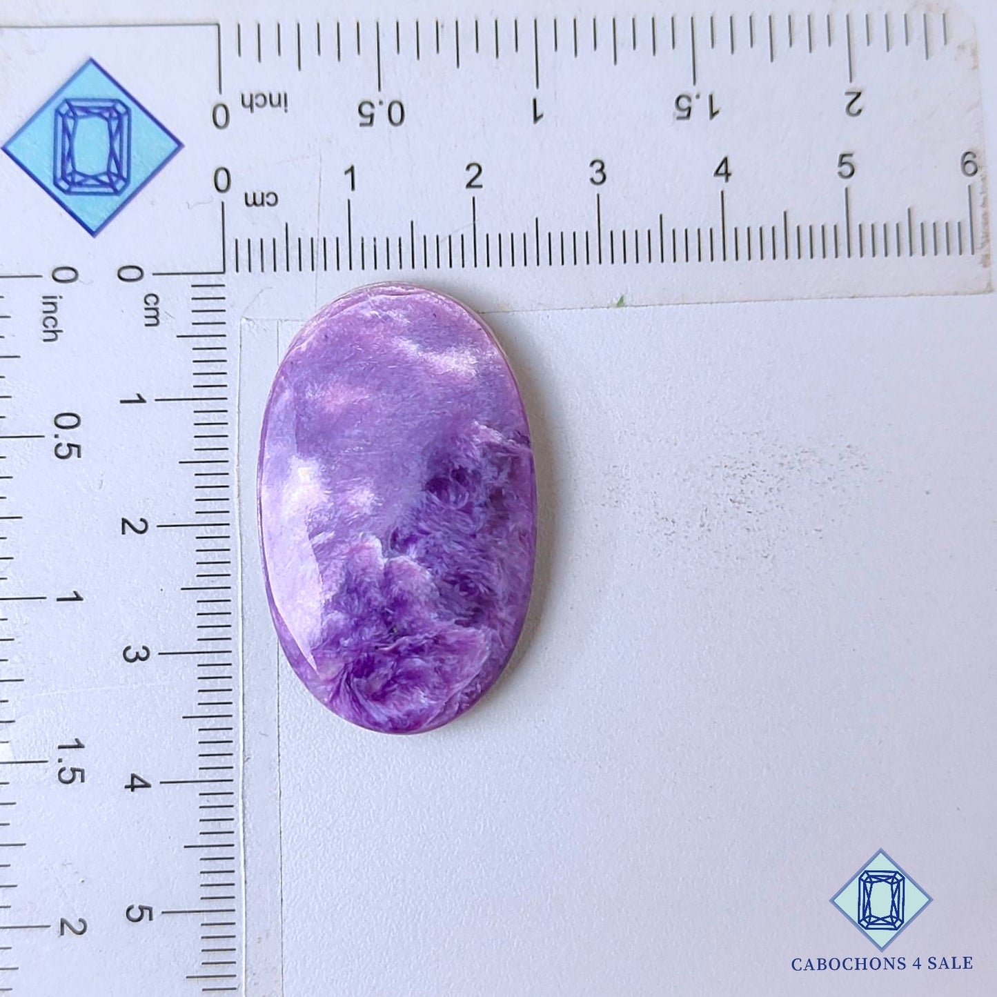 Cabujones ovalados de piedra preciosa de charoita natural de 35 x 21 x 5 mm, procedentes de Rusia, disponibles para la venta.