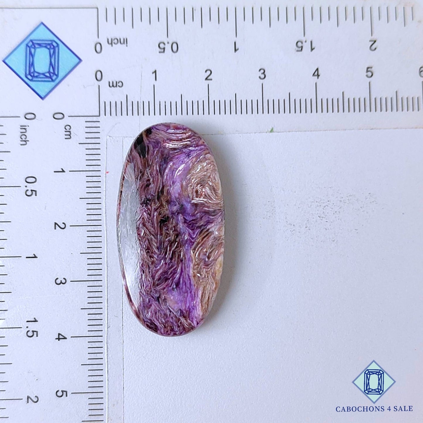 Cabujones ovalados de piedra preciosa de charoita natural de 38 x 19 x 6 mm, procedentes de Rusia, disponibles para la venta.