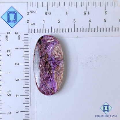 Cabujones ovalados de piedra preciosa de charoita natural de 38 x 19 x 6 mm, procedentes de Rusia, disponibles para la venta.