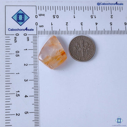 Cabochons4sale translucent fancy fire quartz cabochon with red inclusions, 23x18x6mm, shown next to a US dime.