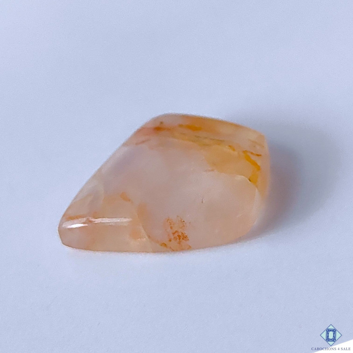 Cabochons4sale translucent red fire quartz fancy cabochon gemstone measuring 23x18x6mm with natural inclusions