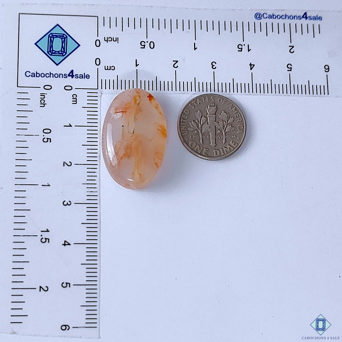 Cabochons4sale oval fire quartz cabochon with red inclusions, translucent finish, 26x16x7mm, shown with a US dime.