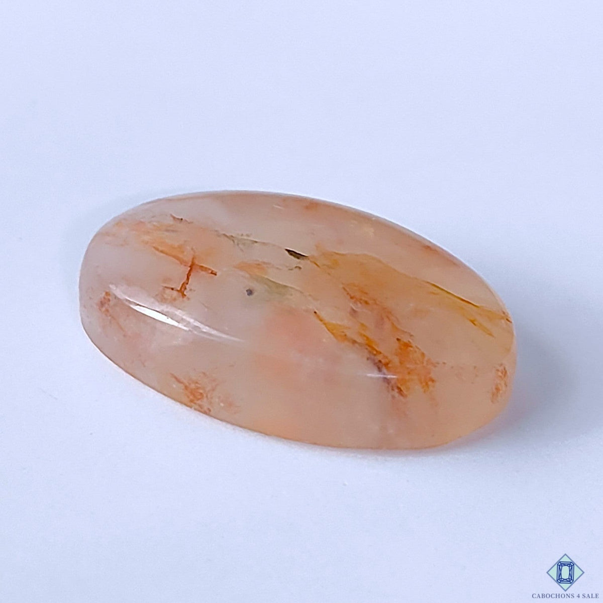 Cabochons4sale oval fire quartz cabochon with translucent red inclusions, 26x16x7mm polished gemstone.