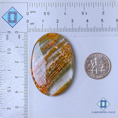 Cabujones ovalados de cuarzo rutilado cacoxenita verde natural de 42 x 29 x 6 mm, de Brasil, disponibles para la venta.