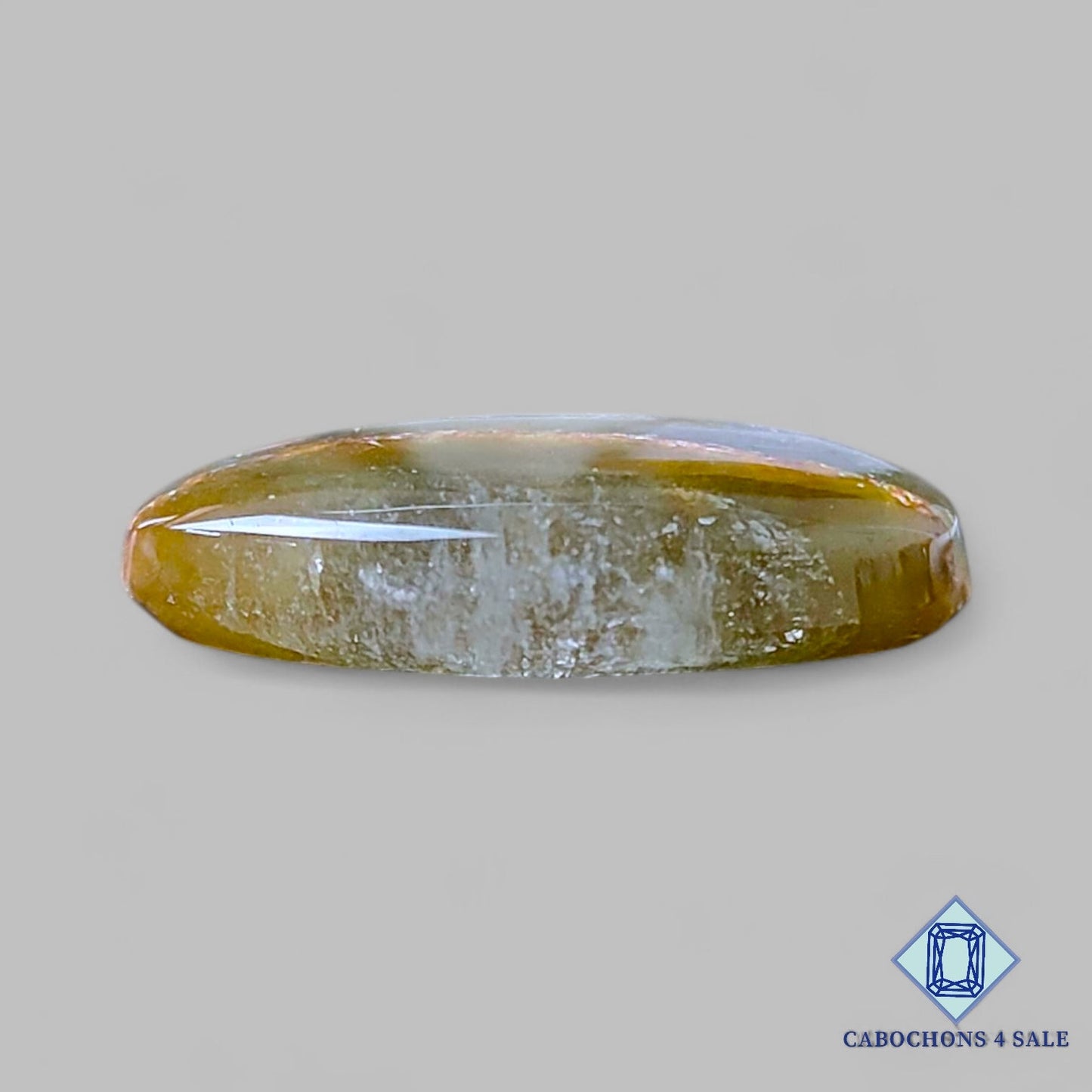 Cabujones ovalados de cuarzo rutilado cacoxenita verde natural de 22 x 17 x 5 mm, de Brasil, disponibles para la venta.