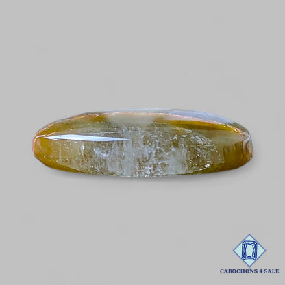 Cabujones ovalados de cuarzo rutilado cacoxenita verde natural de 22 x 17 x 5 mm, de Brasil, disponibles para la venta.