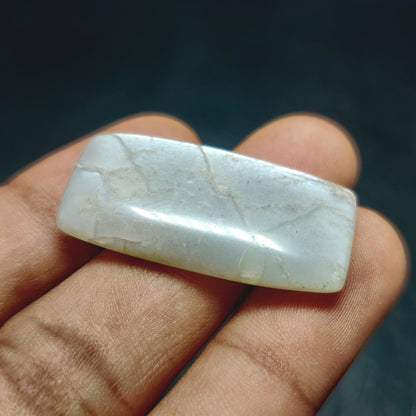 Cabochons4sale natural translucent grey moonstone rectangle cabochon held in hand