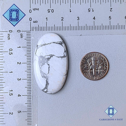 Cabujones ovalados de howlita natural de 38 x 21 x 5 mm, procedentes de California, disponibles para la venta.