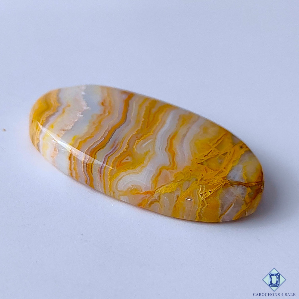 0-Java_Lace_Agate-C4sw23046-3-Oval-Yellow-mm-Cabochons-Opaque-0