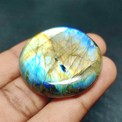 Cabochons4sale round translucent labradorite cabochon featuring vibrant blue and gold iridescent flashes