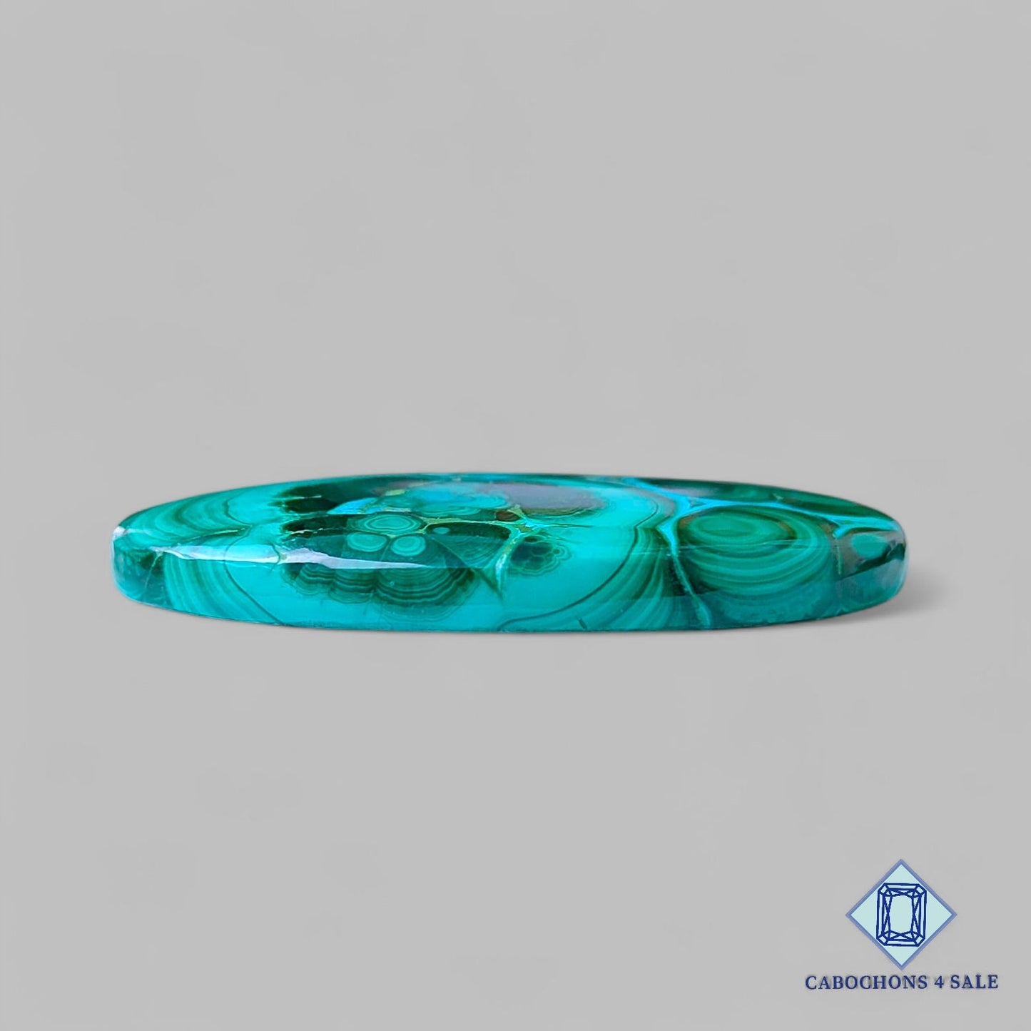 Cabujones ovalados de malaquita crisolcola natural de 45 x 26 x 5 mm, procedentes de la República Democrática del Congo, disponibles para la venta.