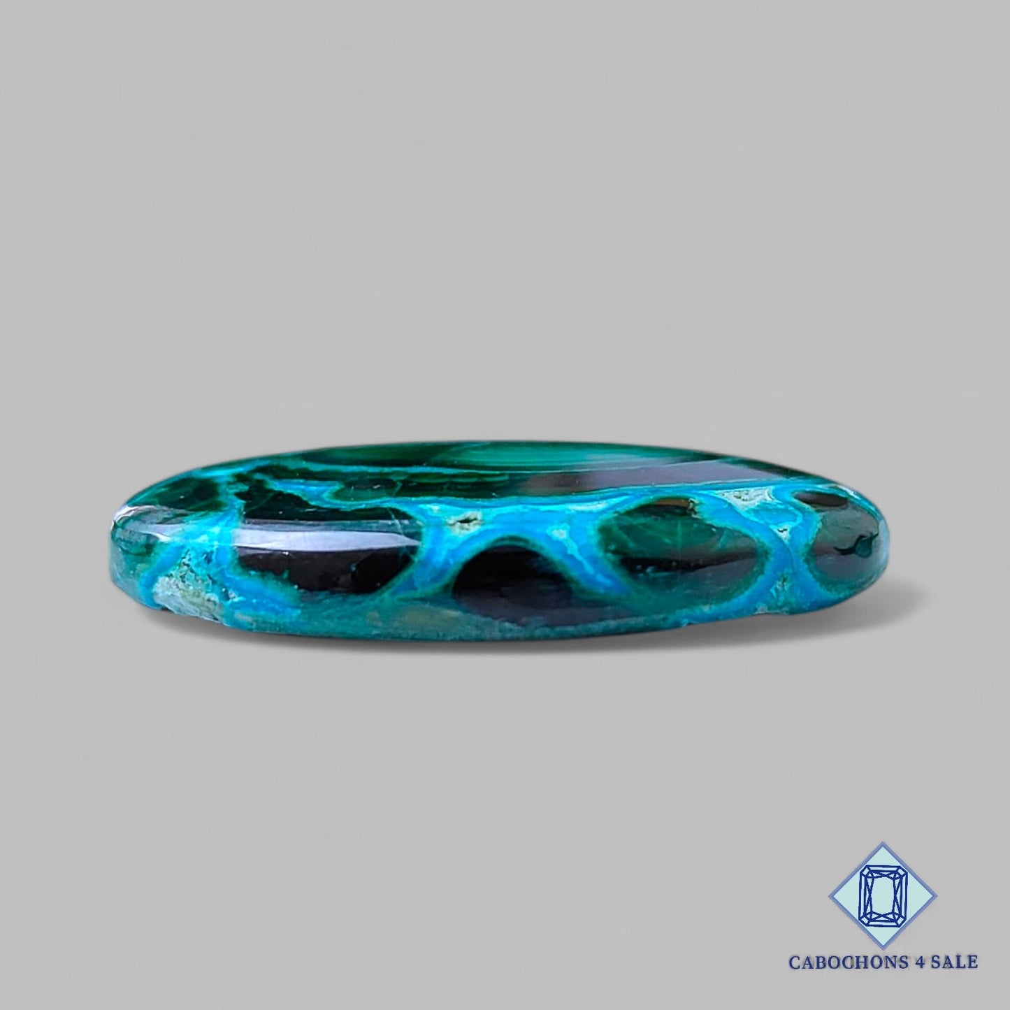 Cabujones ovalados de malaquita crisolcola natural de 30 x 19 x 5 mm, procedentes de la República Democrática del Congo, disponibles para la venta.