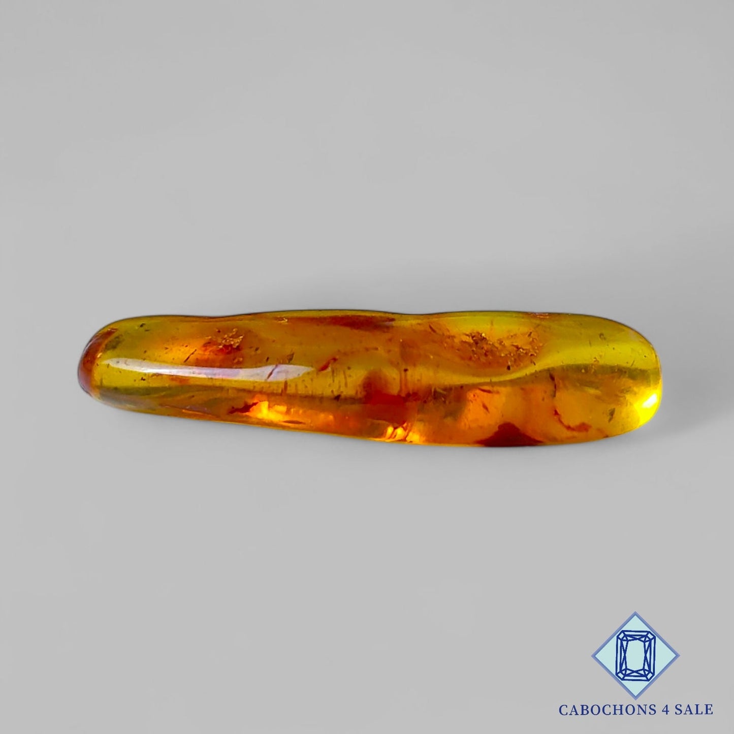 Manmade Amber Gemstone  Fancy Cabochons 34*10*6mm available for sale
