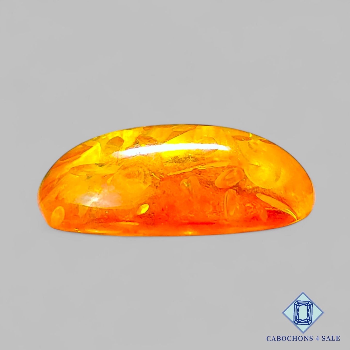 Cabujones ovalados de ámbar sintético de 23 x 17 x 7 mm disponibles para la venta.