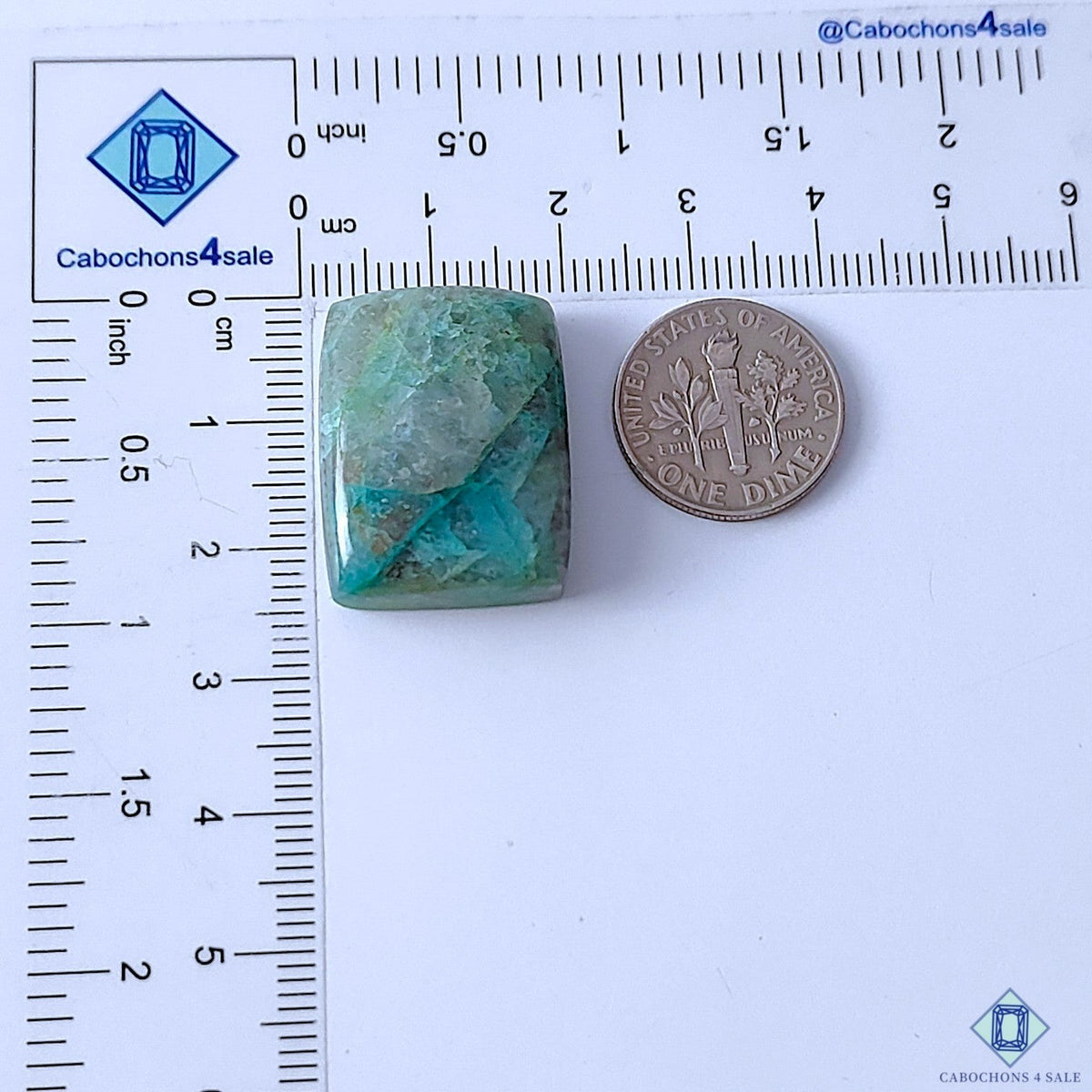 Cabochons4sale rectangle Quantum Quattro cabochon with blue and green patterns next to a US dime for scale