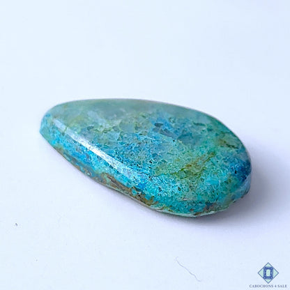 Cabochons4sale pear-shaped Quantum Quattro cabochon with vibrant blue and green opaque gemstone patterns.