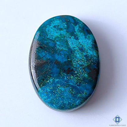 Cabochons4sale oval Quantum Quattro cabochon gemstone featuring vibrant blue and green patterns with opaque finish.