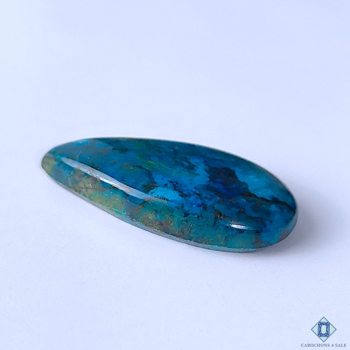 Cabochons4sale natural pear-shaped Quantum Quattro cabochon gemstone with vibrant blue and green opaque patterns.