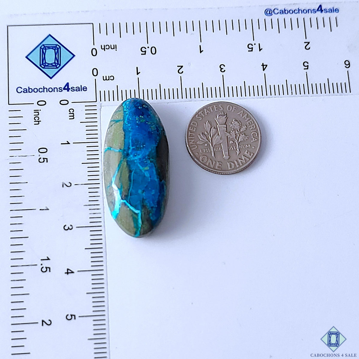 Cabochons4sale oval Quantum Quattro cabochon gemstone featuring vibrant blue and green patterns, 33x15x7mm size.