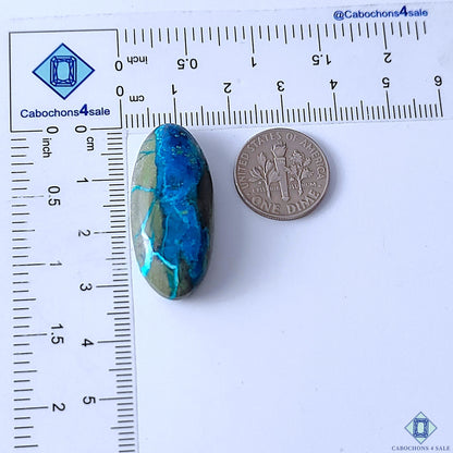Cabochons4sale oval Quantum Quattro cabochon gemstone featuring vibrant blue and green patterns, 33x15x7mm size.