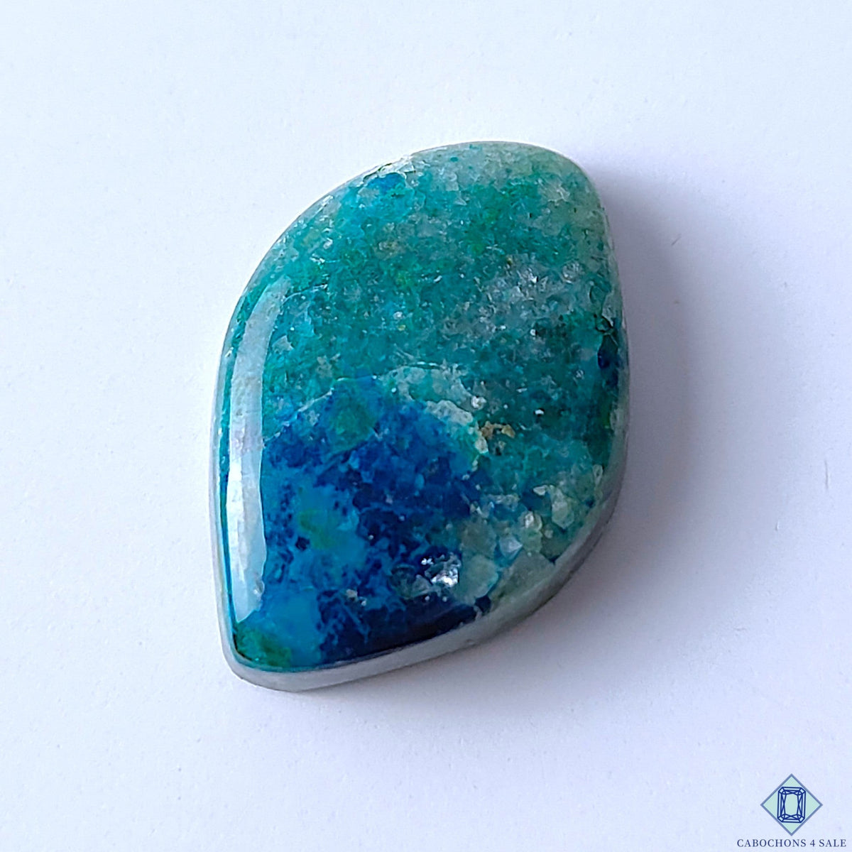 Cabochons4sale fancy Quantum Quattro gemstone cabochon with vibrant blue and green opaque patterns, 31x22x8mm.